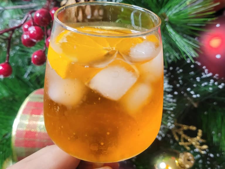 Aperol spritz in front of a Christmas tree