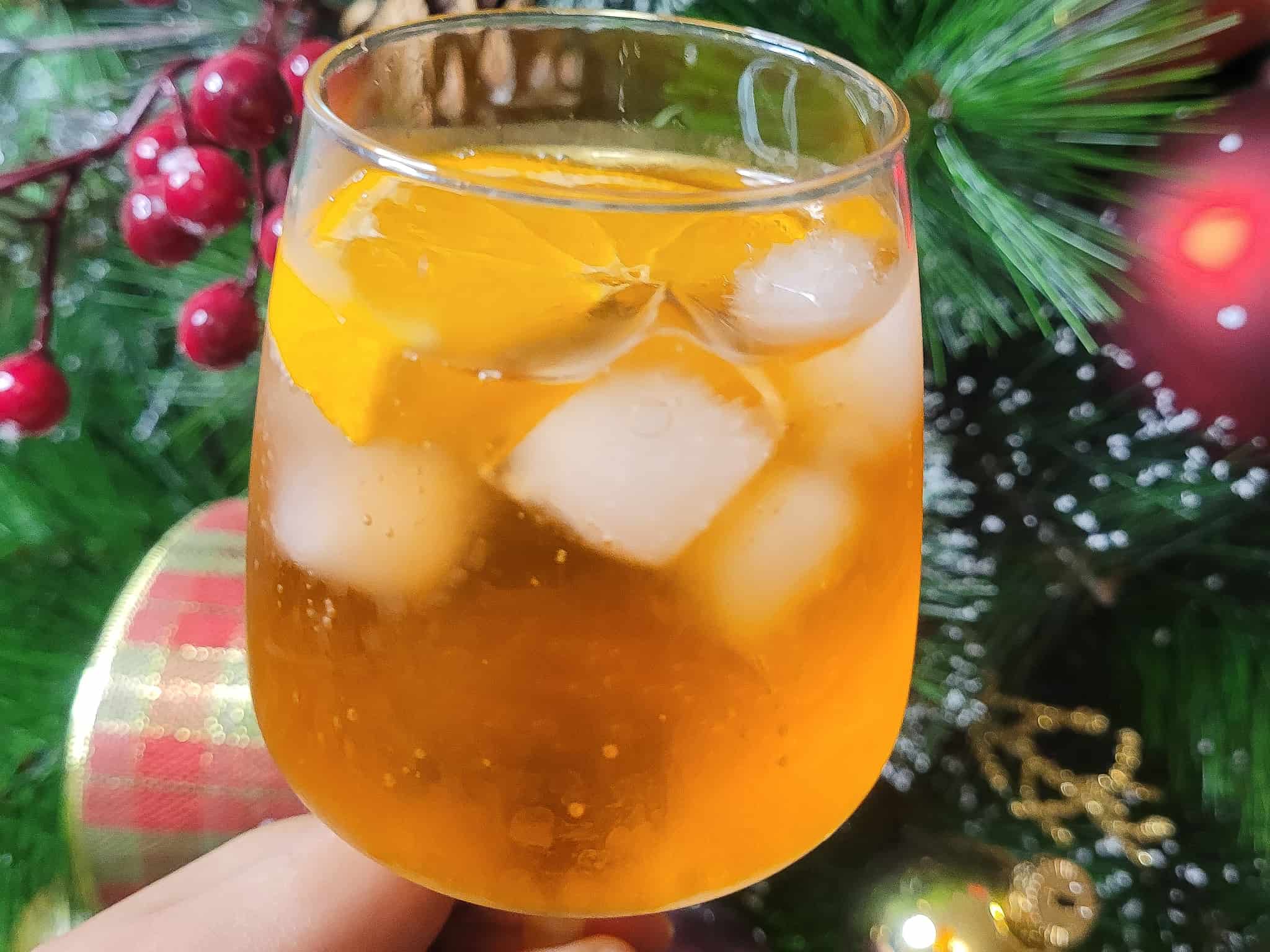 Aperol spritz in front of a Christmas tree
