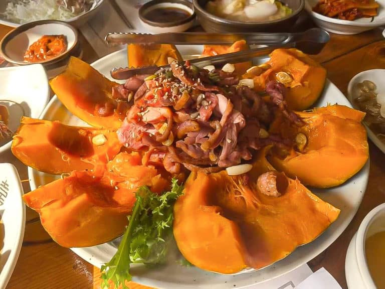 Korean smoke duck with slices pumpkin around