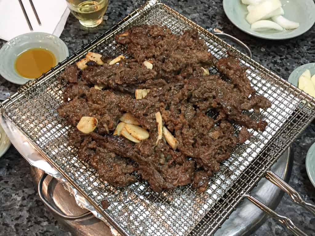 Eonyang bulgogi served on top of the special grill rack used to cook it over coals