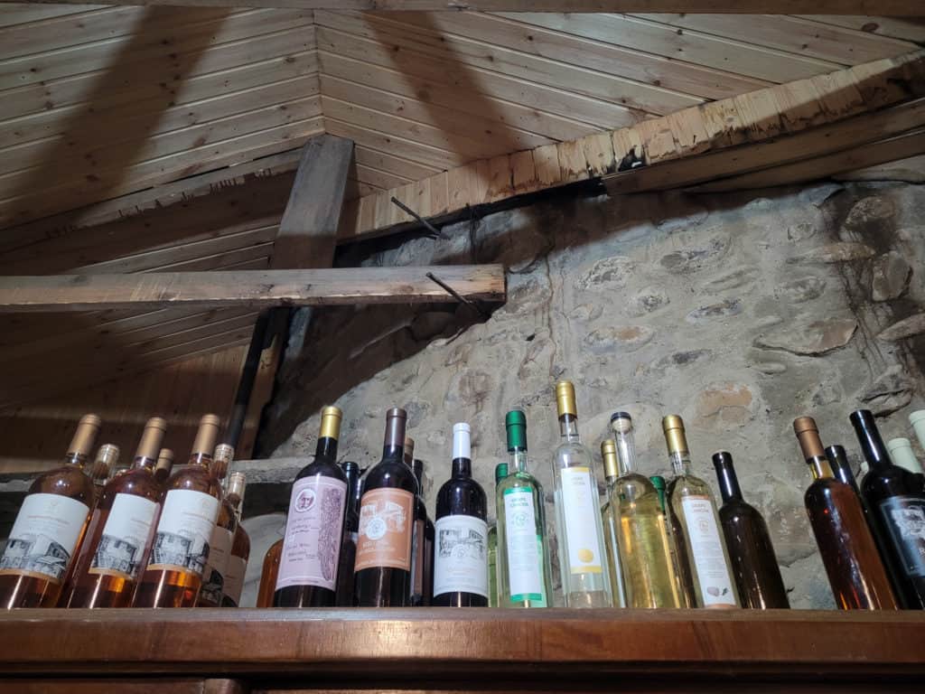 Various bottles sitting on top of a cabinet in a wine tasting cellar in Telavi, Georgia