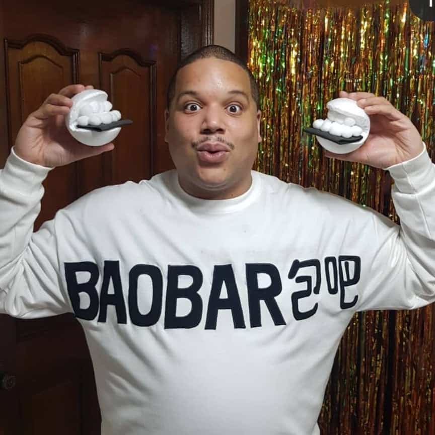 Man in a bao custom holding buns for Halloween