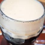A glass of Czech style beer that is a dark lager