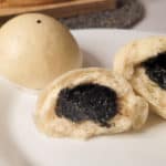 Black sesame seed buns on a plate