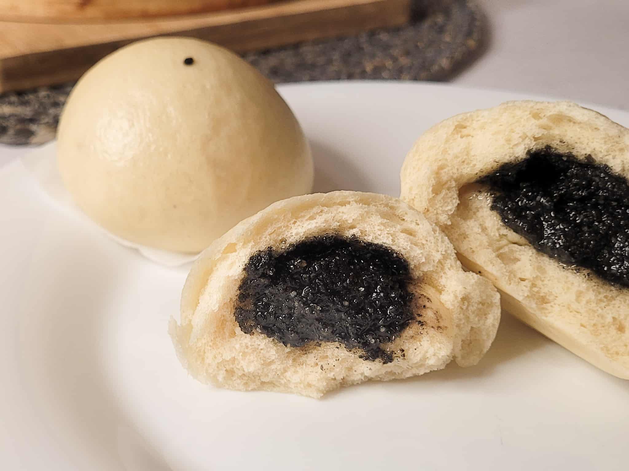 Black sesame seed buns on a plate