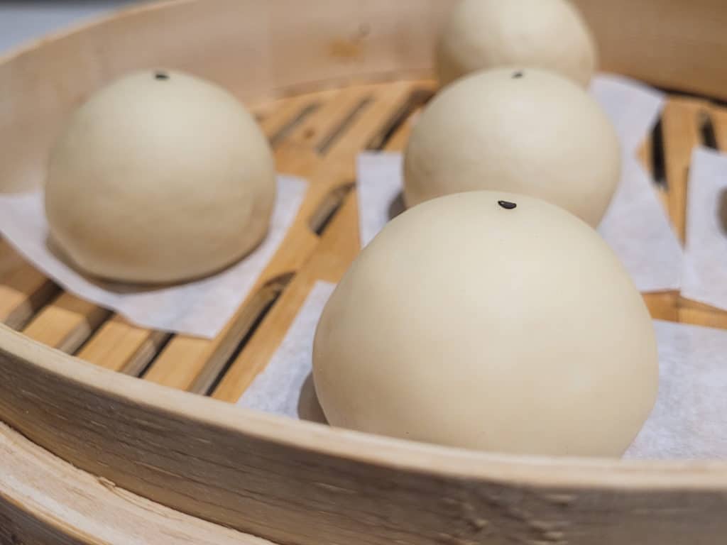 Close up of buns proofing before steaming