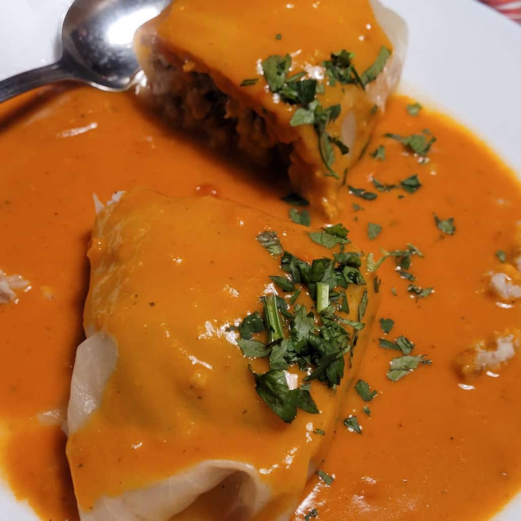 Closeup of a cabbage roll on a white plate