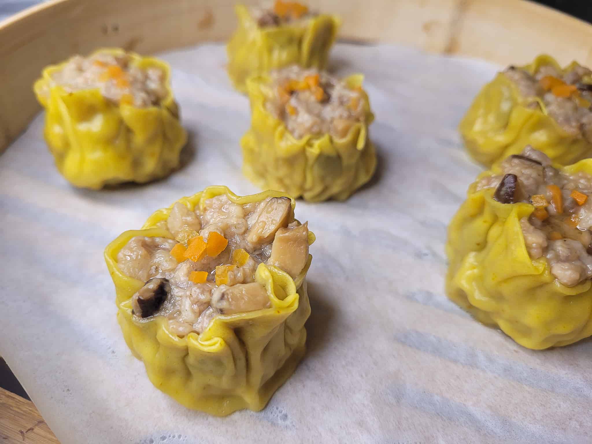 Closeup of siu mai in bamboo steamer