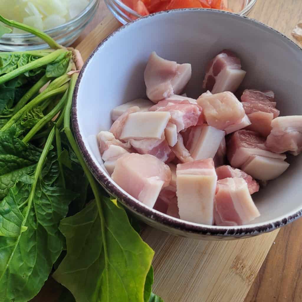 A cutting board that has several ingredients on top of it