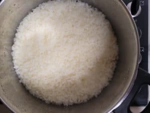 Cooked glutinous rice in a silver pot