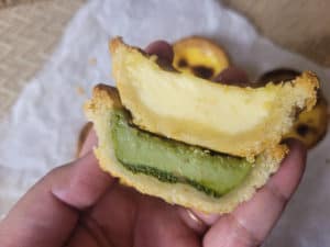 Crosscut view of egg tarts and matcha tarts