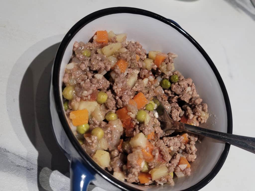 A bowl of sauteed pork and vegetables