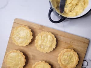 Overhead shot of filled cashew yema tart shells