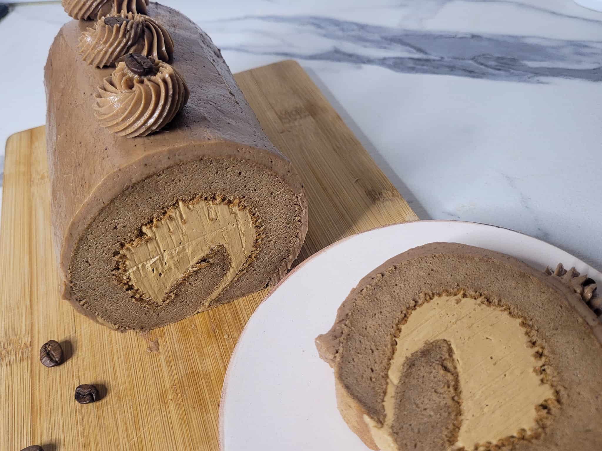 Mocha cake roll with slice of cake