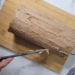 Mocha roll with first layer of coffee buttercream frosting