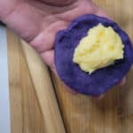 Custard in the middle of purple dough