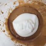 creamed butter with meringue in bowl
