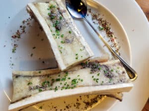 Two logs of bone marrow on a plate