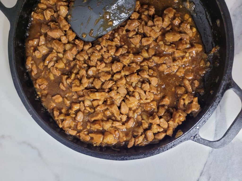 Overhead of thickened sauce in asado filling