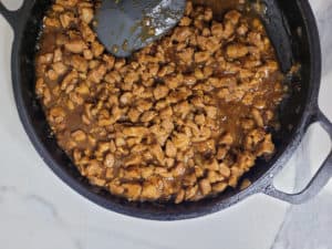 Overhead of thickened sauce in asado filling