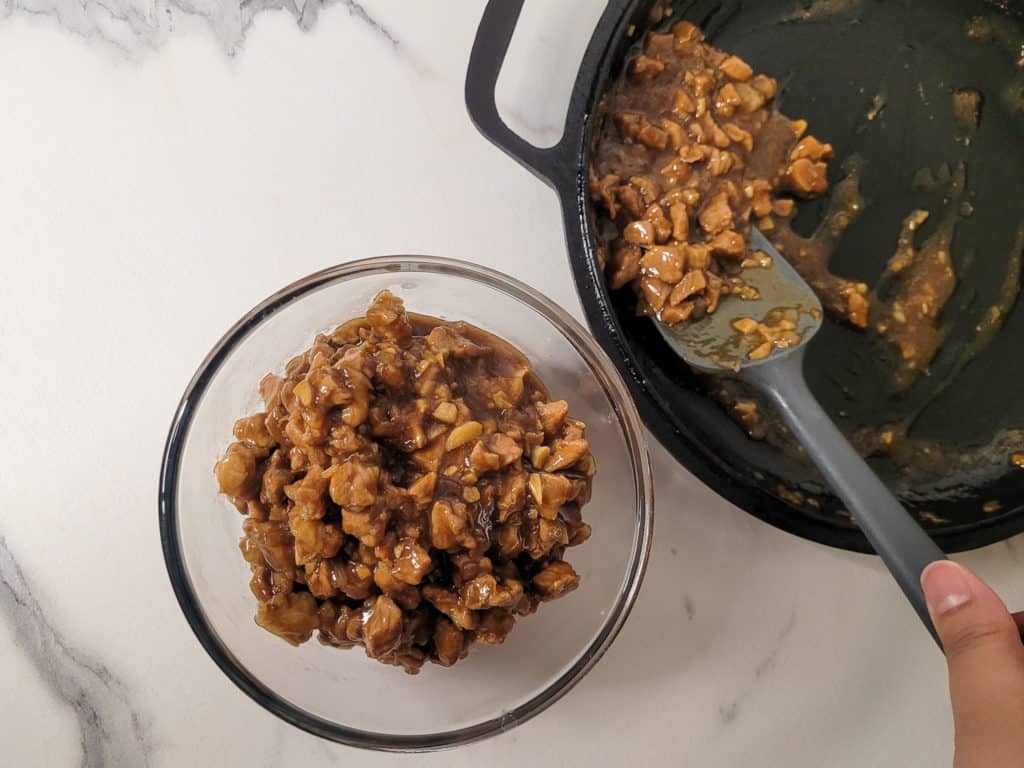 Cooked asado filling placed in a bowl with spatula