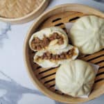 Overhead shot of siopao asado or Filipino buns in a steamer basket