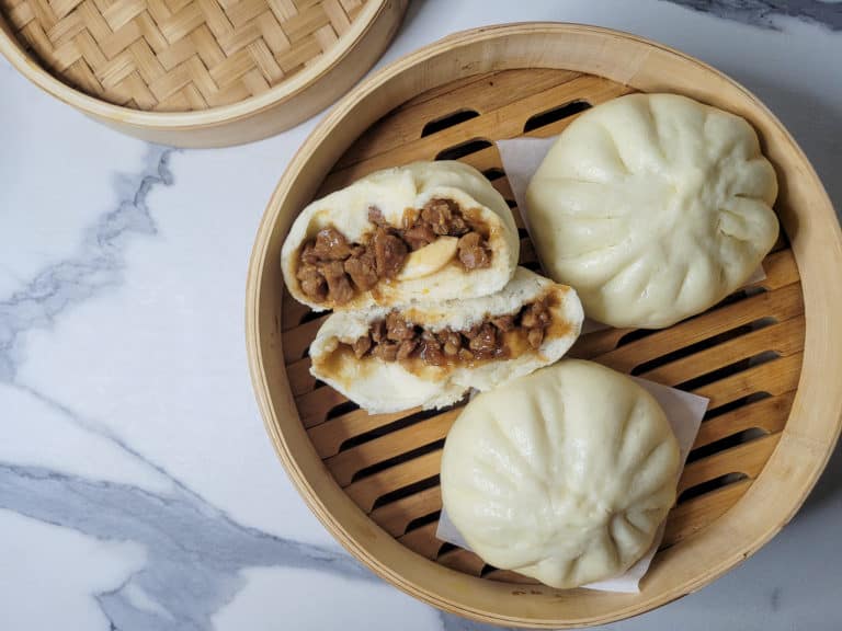 Overhead shot of siopao asado or Filipino buns in a steamer basket