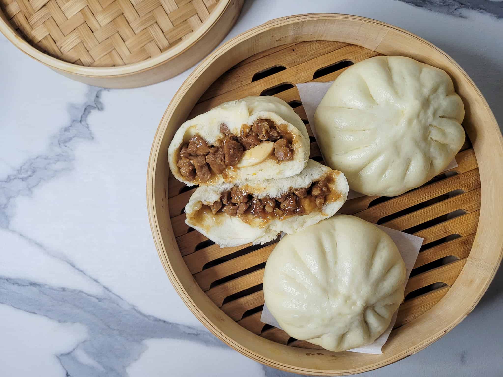 Overhead shot of siopao asado or Filipino buns in a steamer basket