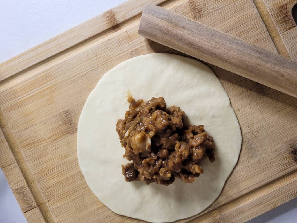 Filling in center of rolled dough dumpling