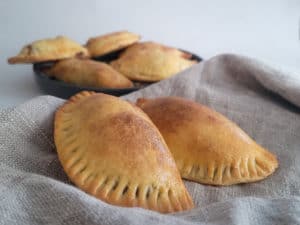 Closeup of Filipino adobo empanadas on a towel