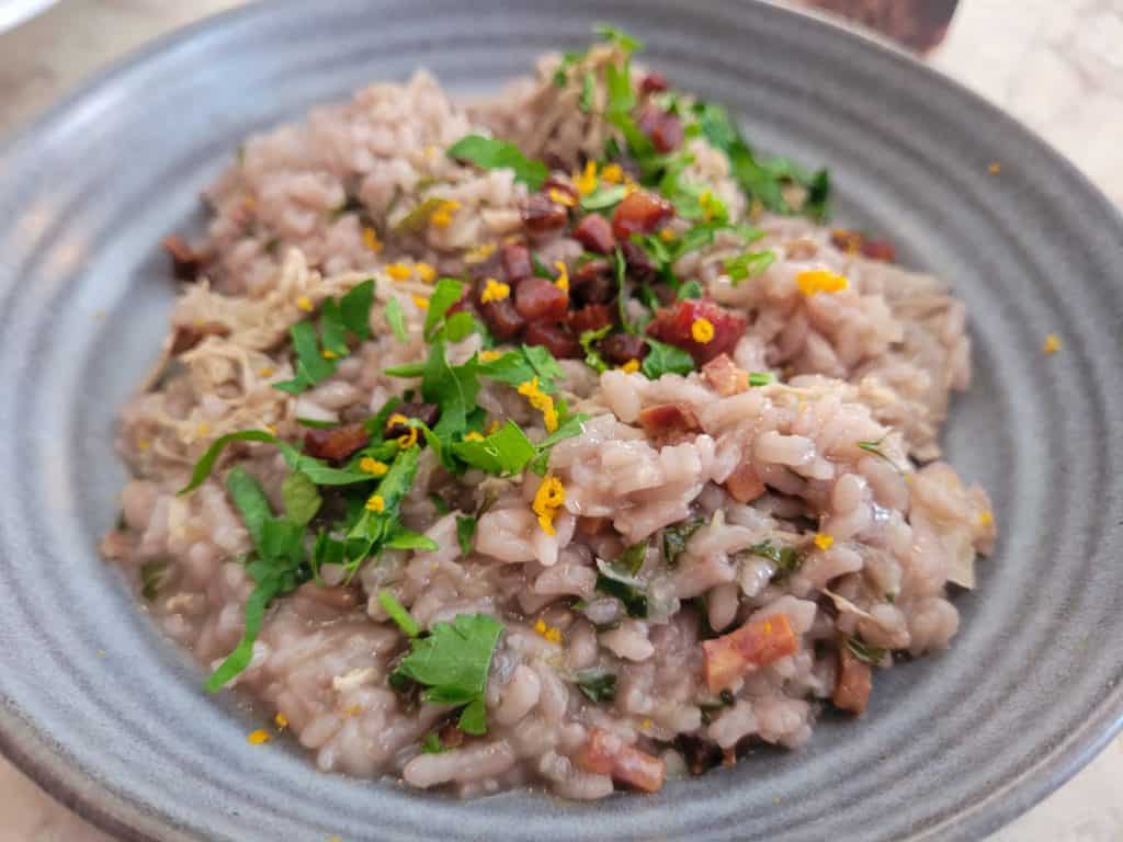 Duck rice in a gray bowl