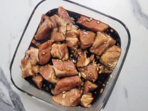 Marinated pork in a clear container