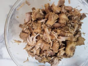 Shredded pork in a clear bowl