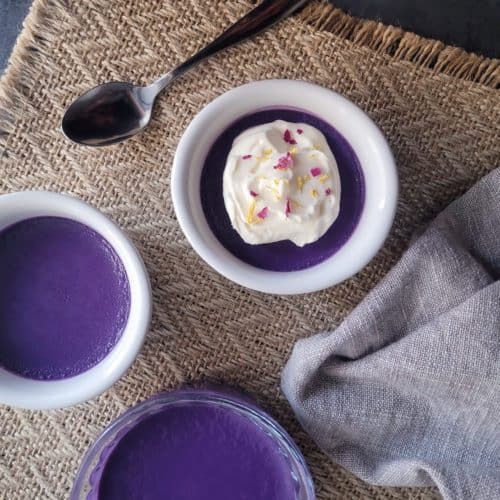 Overhead of ube pot de creme on a rustic placemat
