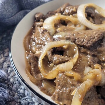 Closeup of Bistek tagalog or Filipino beefsteak