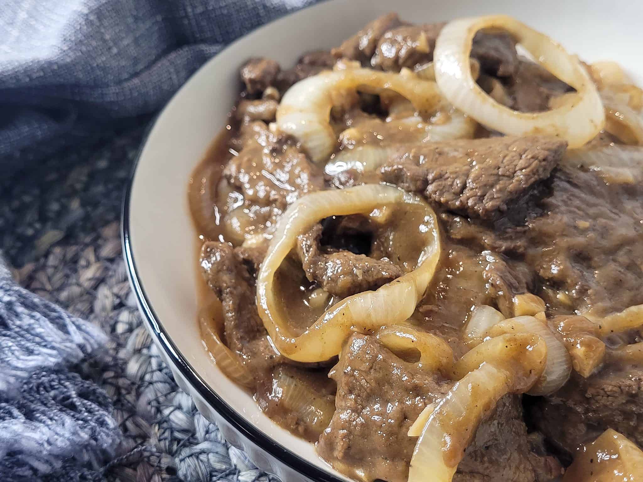 Closeup of Bistek tagalog or Filipino beefsteak