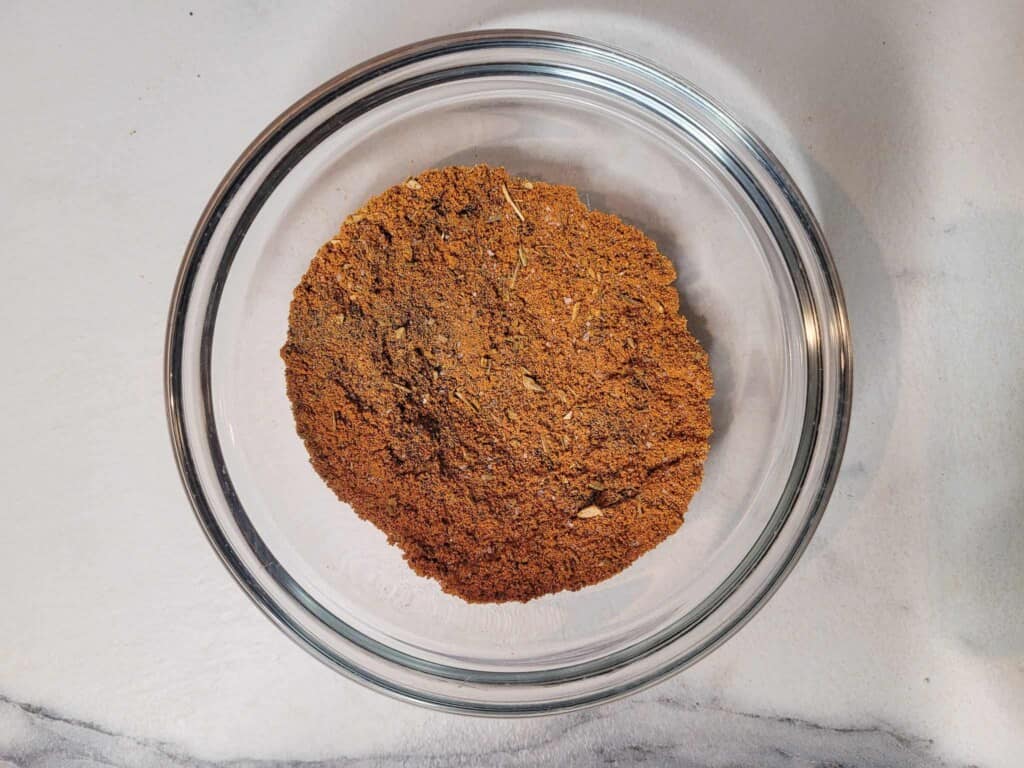 Chili powder seasoning in a glass bowl
