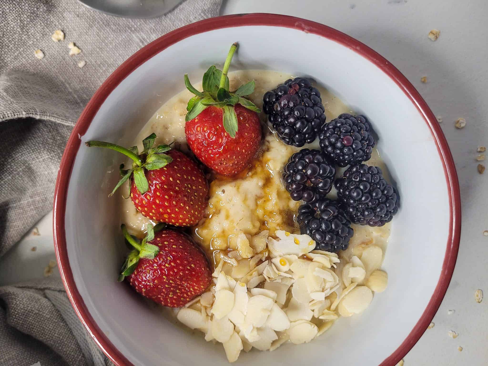 Closeup of oatmeal custard with fruits and almonds