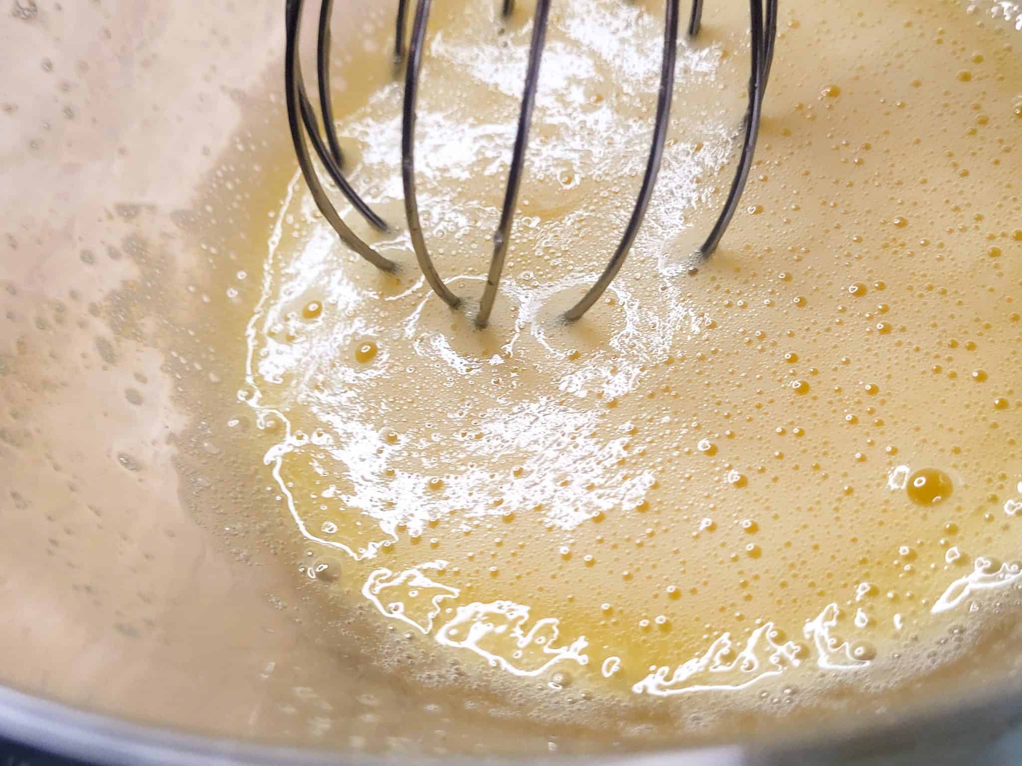 Closeup of whisked egg and egg yolk