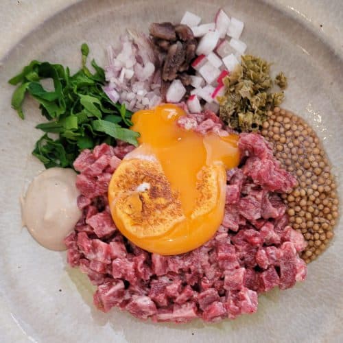 Beef Tartare with broken egg yolk at O Frade