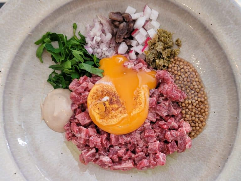 Beef Tartare with broken egg yolk at O Frade