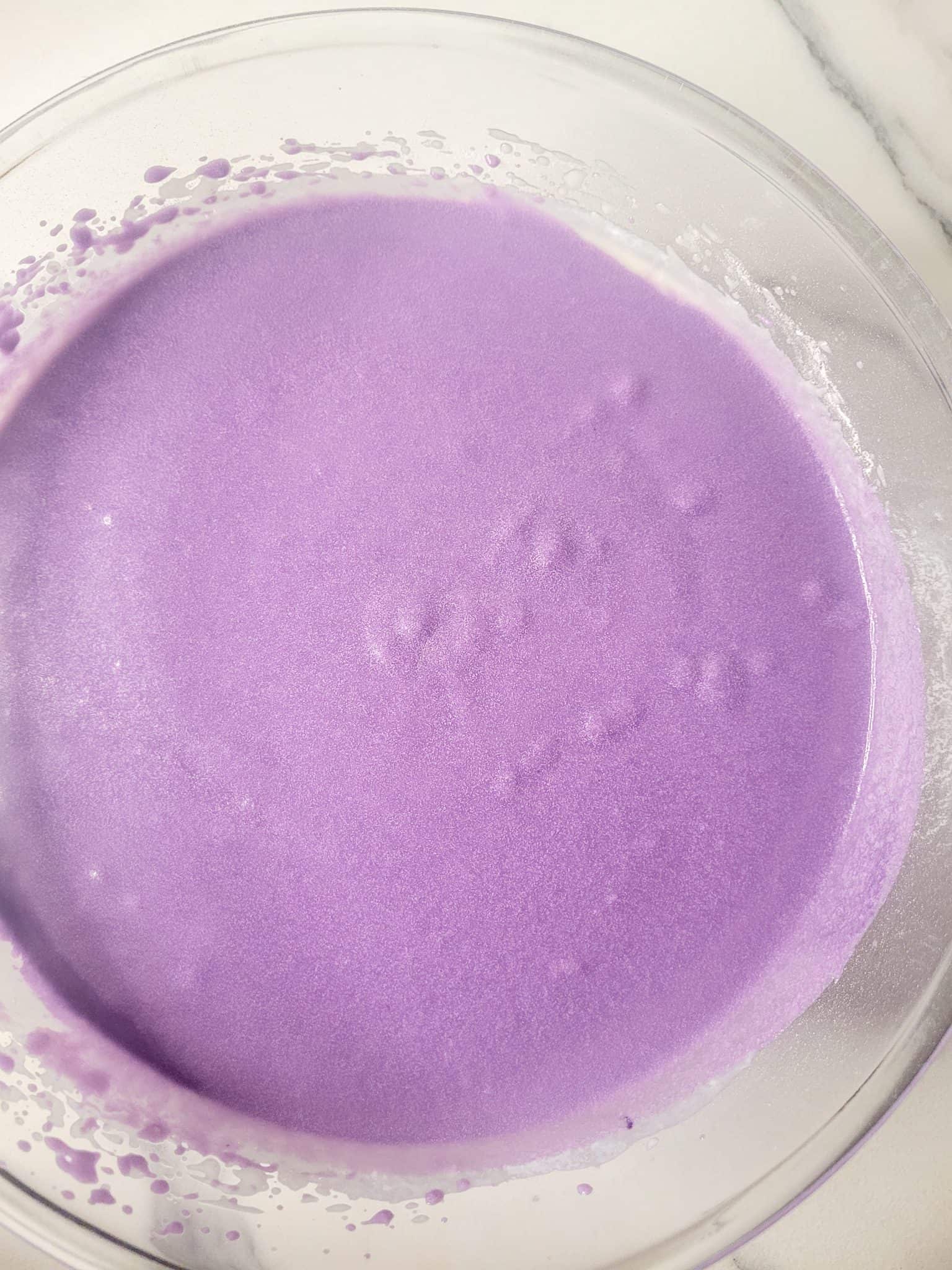 Raw ube butter mochi batter in a bowl