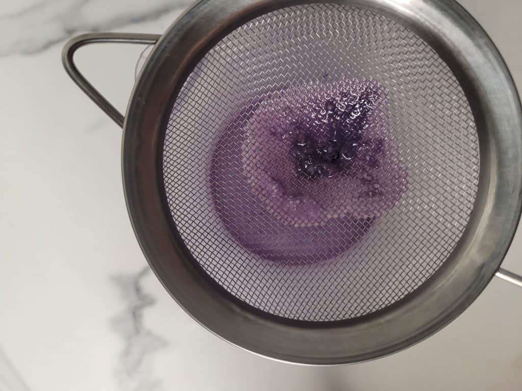 Strained ub custard with a sieve
