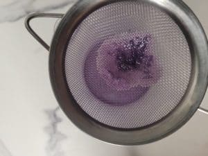 Strained ub custard with a sieve