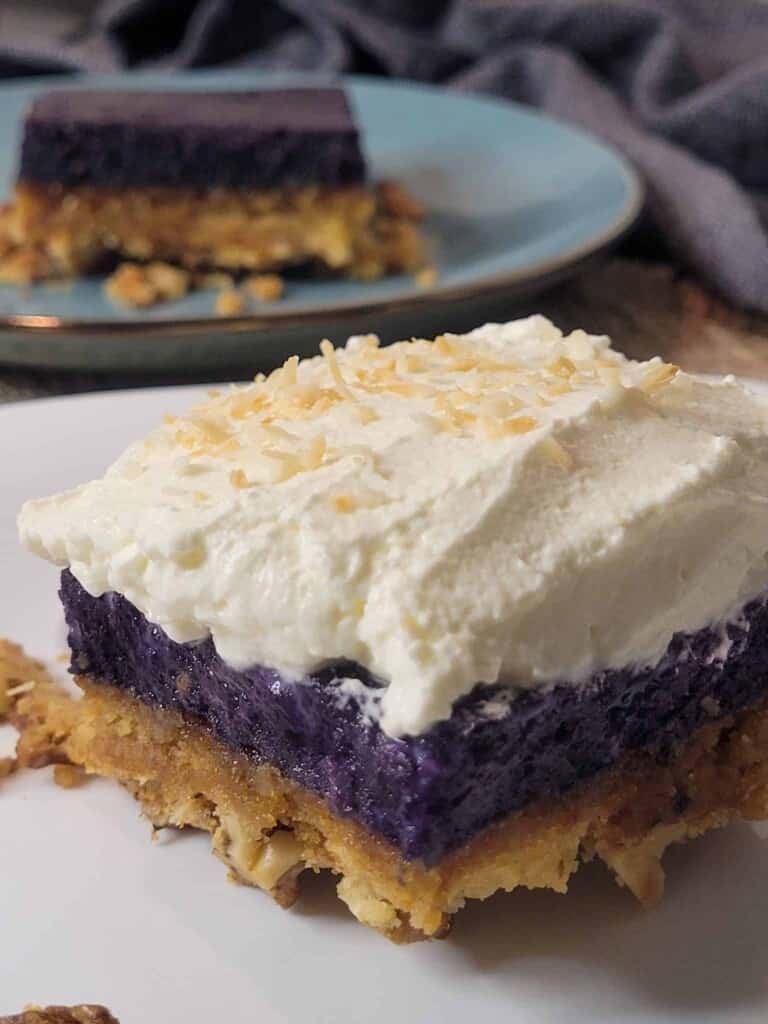 Ube crunch cake close up with another cake in background