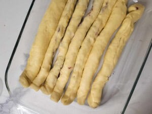 Strips of dough in a glass baking dish