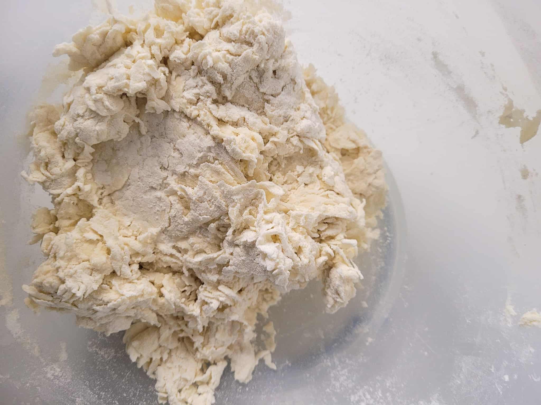 Shaggy dough made with flour and water in a bowl