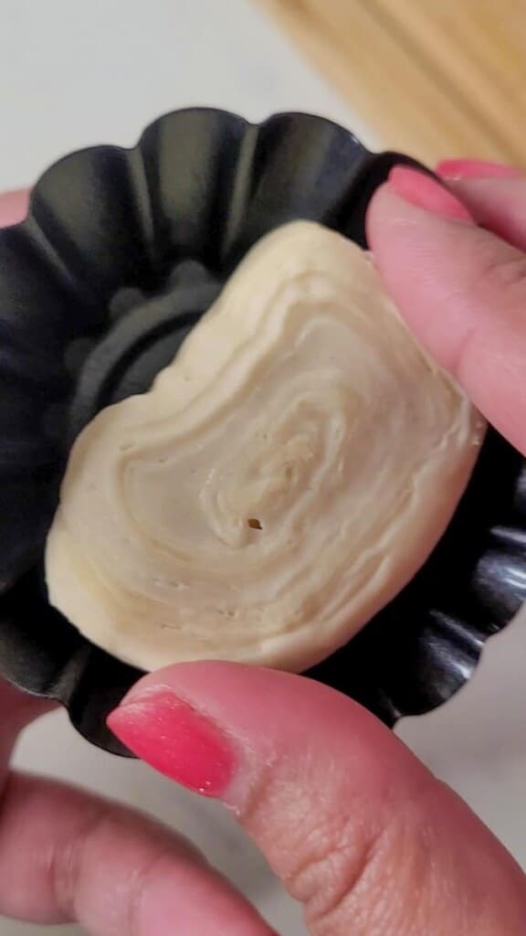 Closeup of pastry dough inside a mold