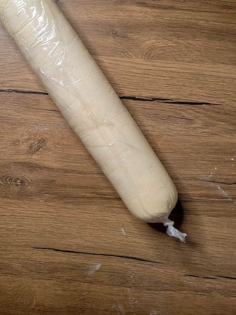 Overhead of rolled pastry dough on a wooden surface