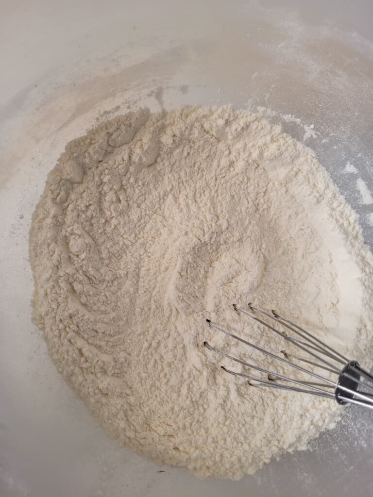 Mixed dry ingredients in a plastic bowl